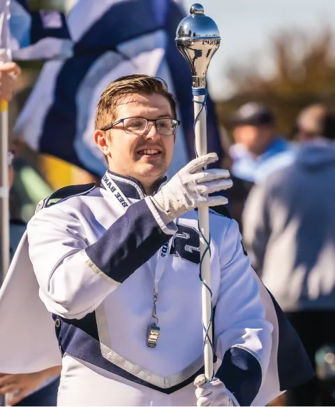 Marching band outdoors during homecoming.